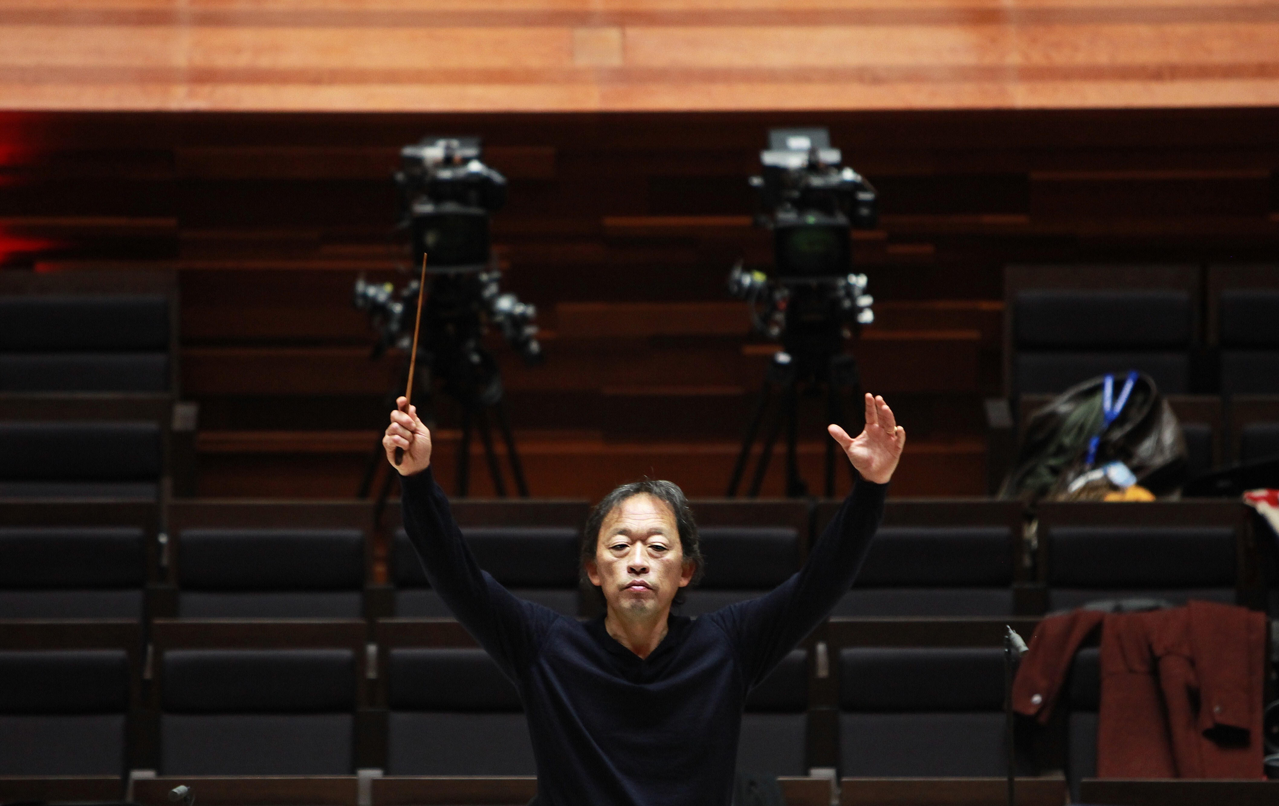 Myung-Whun Chung conducts the Radio France Philharmonic orchestra during a rehearsal at the Maison de la Radio before its inauguration on November 14, 2014, in Paris.